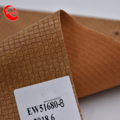 Comercio al por mayor de cuero sintético de PU en relieve de diseño de tejido para zapatos